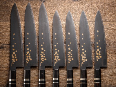 This kitchen knife is decorated with a Japanese motif of autumn leaves.