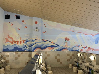 A woman's indoor bath with vivid contemporary art painted on the walls by students of Kyoto Seika University.