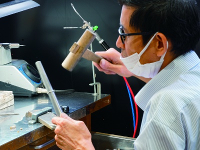 Across from the store is our own workshop, where you can observe skilled artisans crafting jewelry.