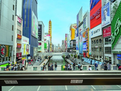 Minami is a typical downtown area in Osaka. Large billboards including 