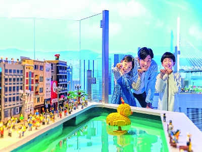 A diorama of famous places in Osaka, including Tsutenkaku Tower, recreated using Lego ® blocks.