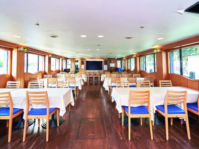 The atmosphere inside the ship is calm and wooden. You can enjoy the view from the large window.