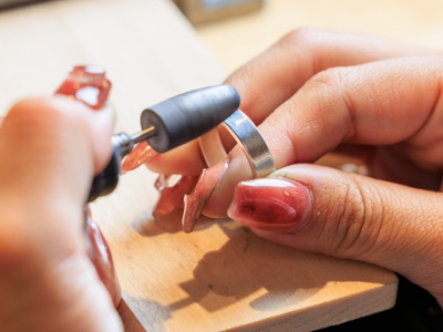 The ring is heated to soften it, then hammered, polished, inscribed, etc. to create the design of your choice.