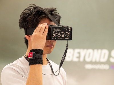 When playing, players wear special goggles and arm sensors. The player fights against the opposing team by producing energy balls and shields from his or her hands.
